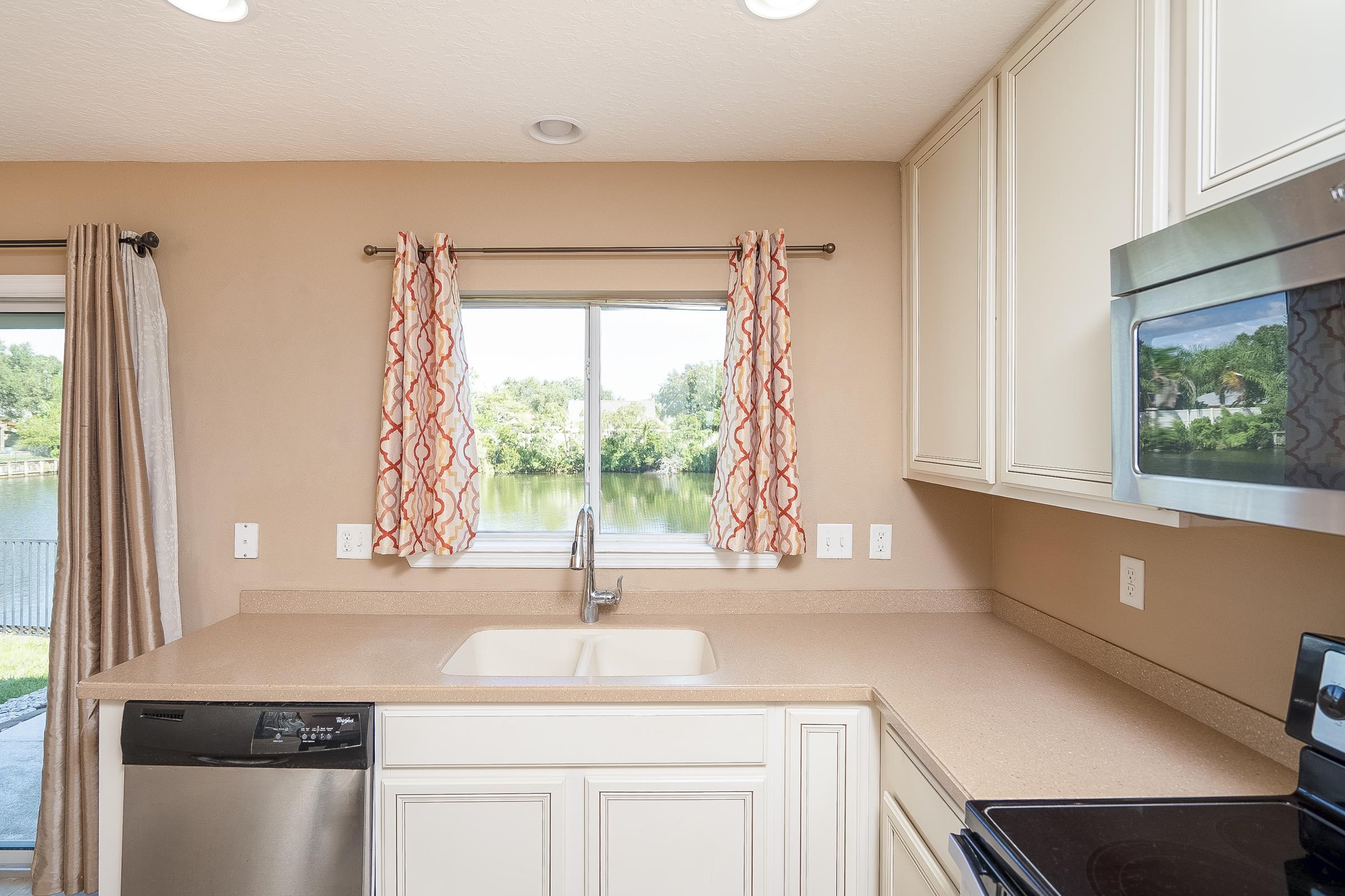 183 Islander Drive St. Augustine, FL 32080 - Photo 18 of 36 a kitchen with a sink and a window