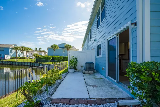 a view of a livingroom with a ceiling fan and window
