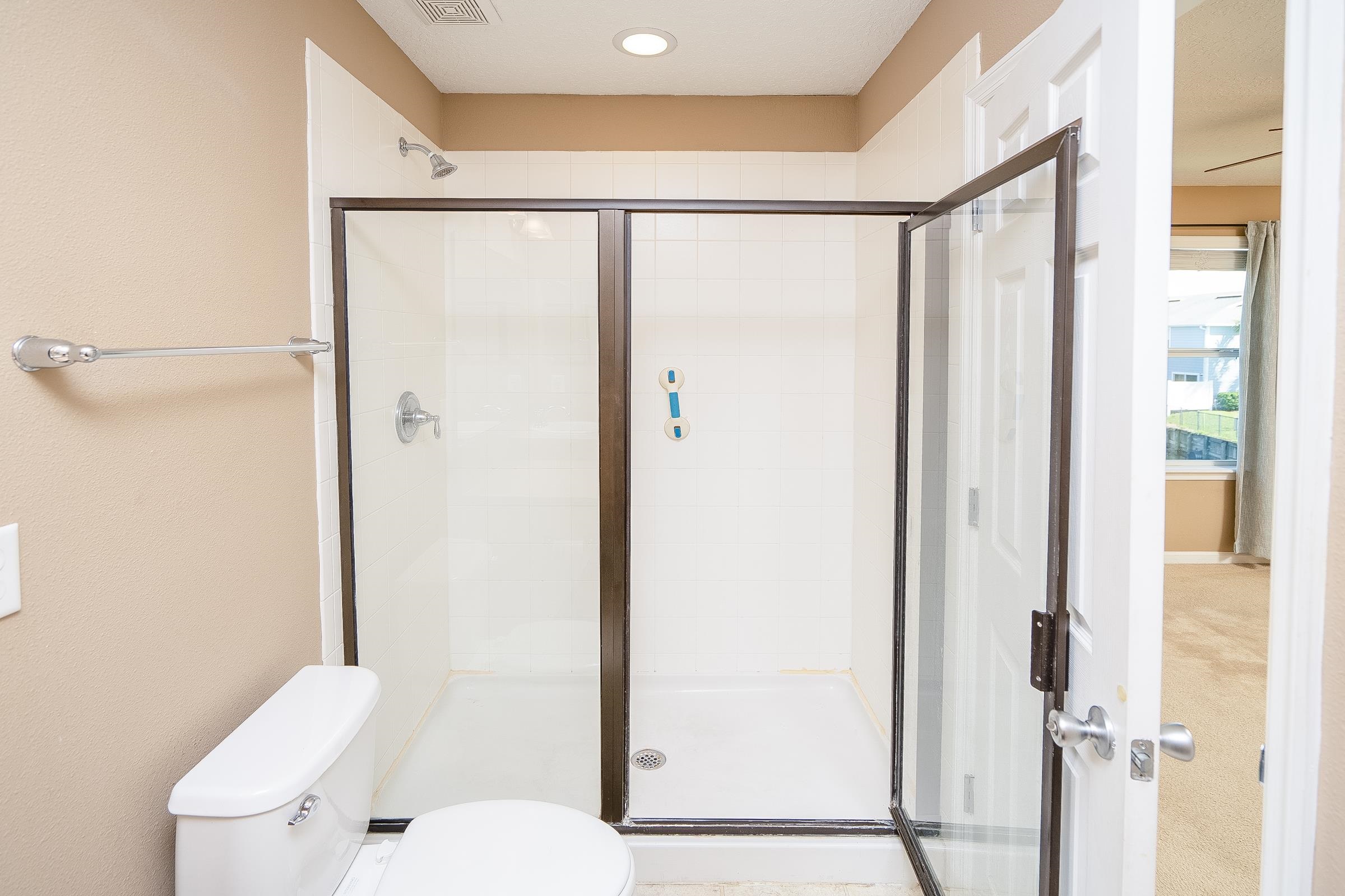 183 Islander Drive St. Augustine, FL 32080 - Photo 28 of 36 a white toilet sitting next to a bathroom sink