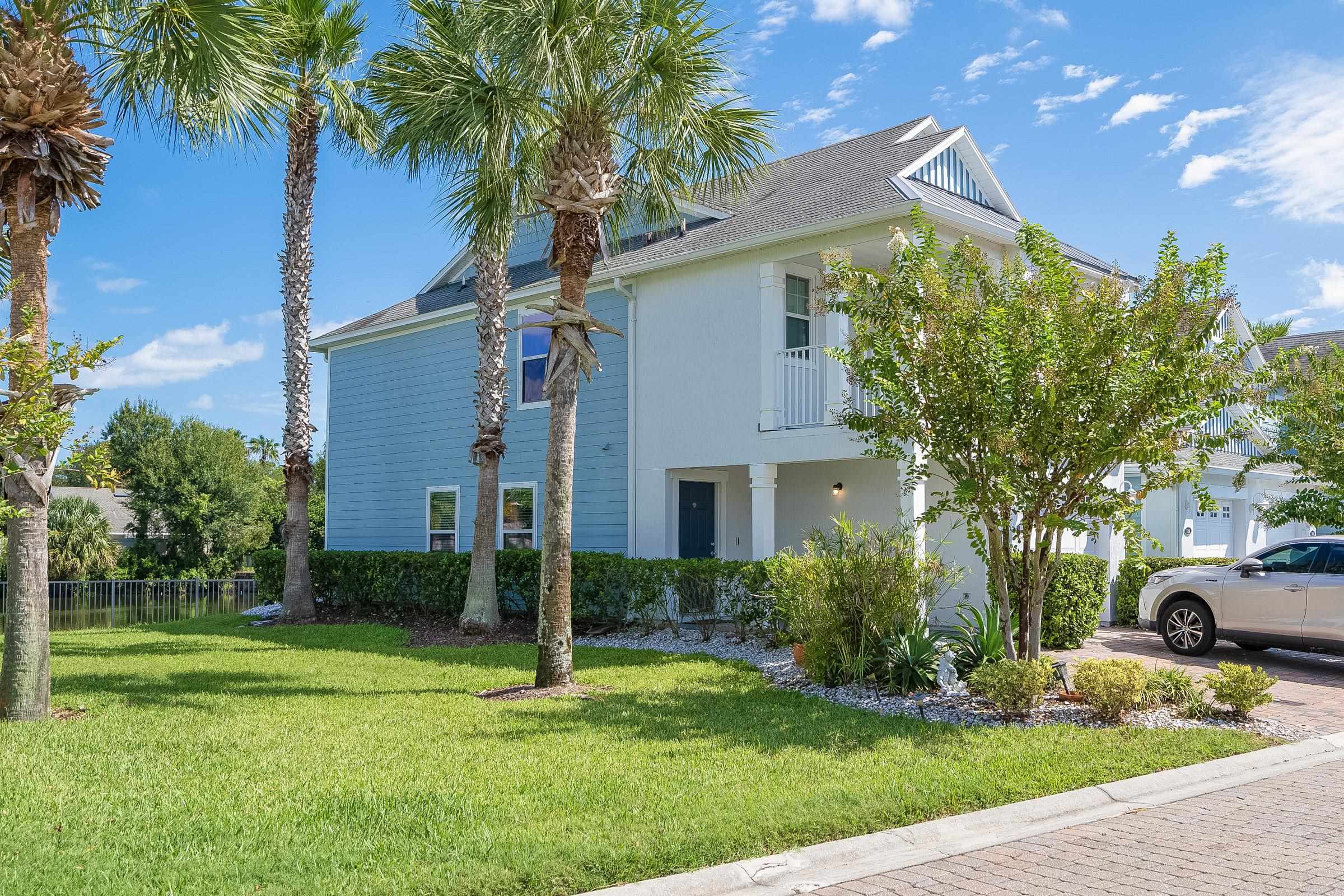 183 Islander Drive St. Augustine, FL 32080 - Photo 4 of 36 a front view of a house with garden