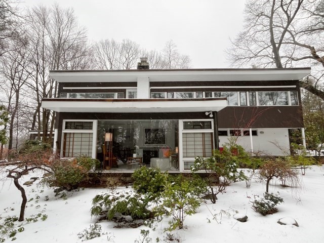 front view of a house with a yard