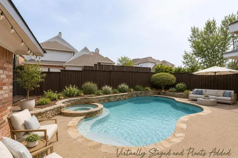 a view of a house with patio furniture and a potted plants