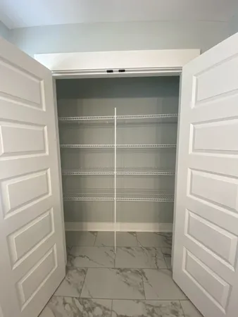 a view of an empty walk in closet