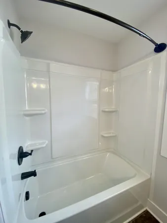 an empty room with a empty space and windows
