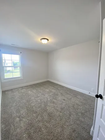 an empty room with closet area