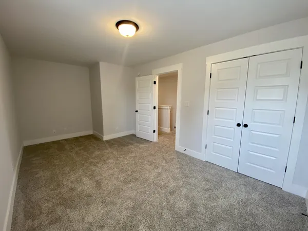 a view of an empty room and closet