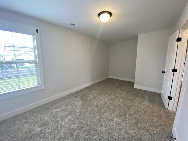 a view of entryway with bathroom