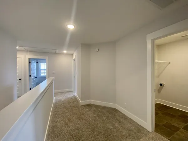a view of an empty room and a window
