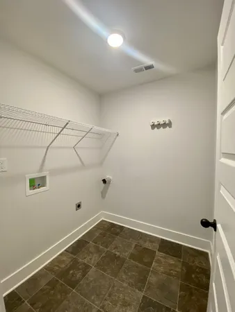 a view of empty room with windows