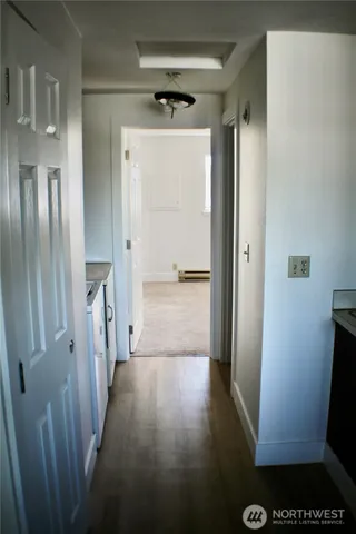 a view of entryway with wooden floor