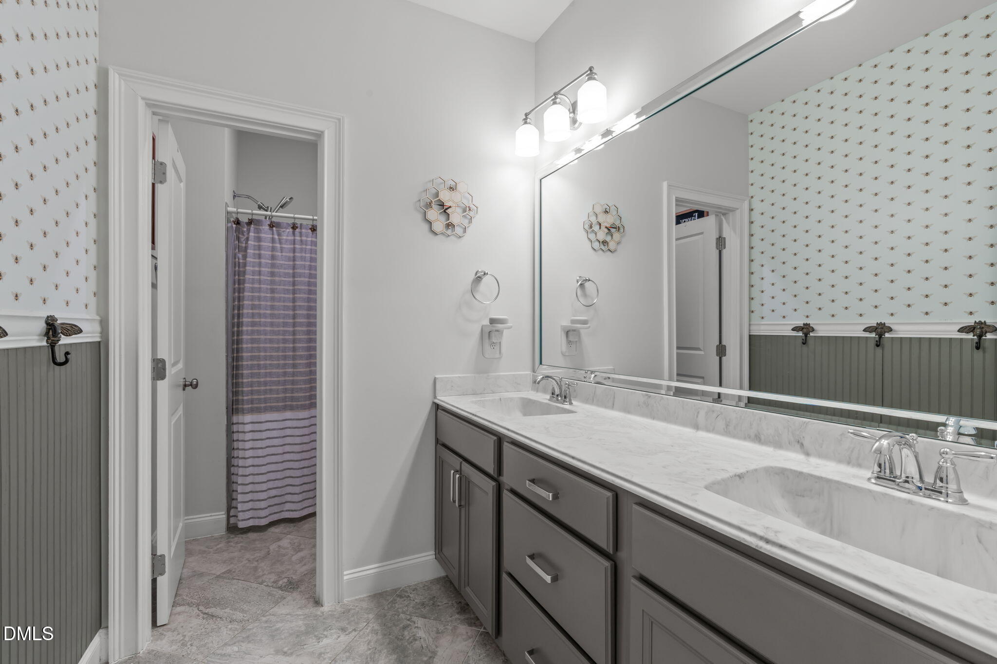 4144 Olde Judd Drive Willow Spring, NC 27592 - Photo 27 of 52 a bathroom with a sink double vanity and a mirror