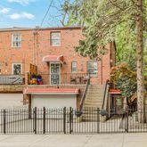 a front view of a house with balcony