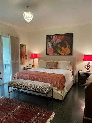 a bedroom with bed and window