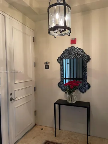 a room with a mirror and a fan