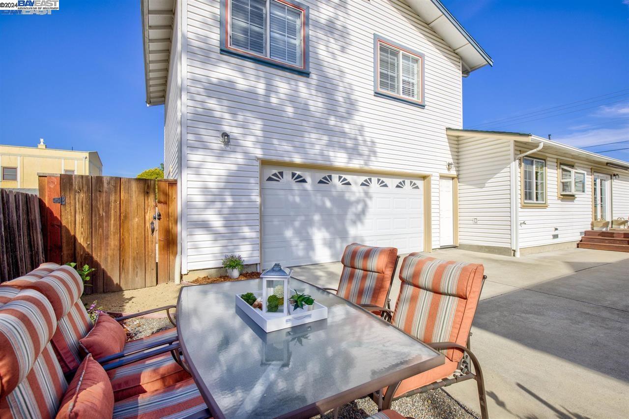 1746 3rd Street, Unit B Livermore, CA 94550 - Photo 12 of 12 front view of a house with a table and chairs