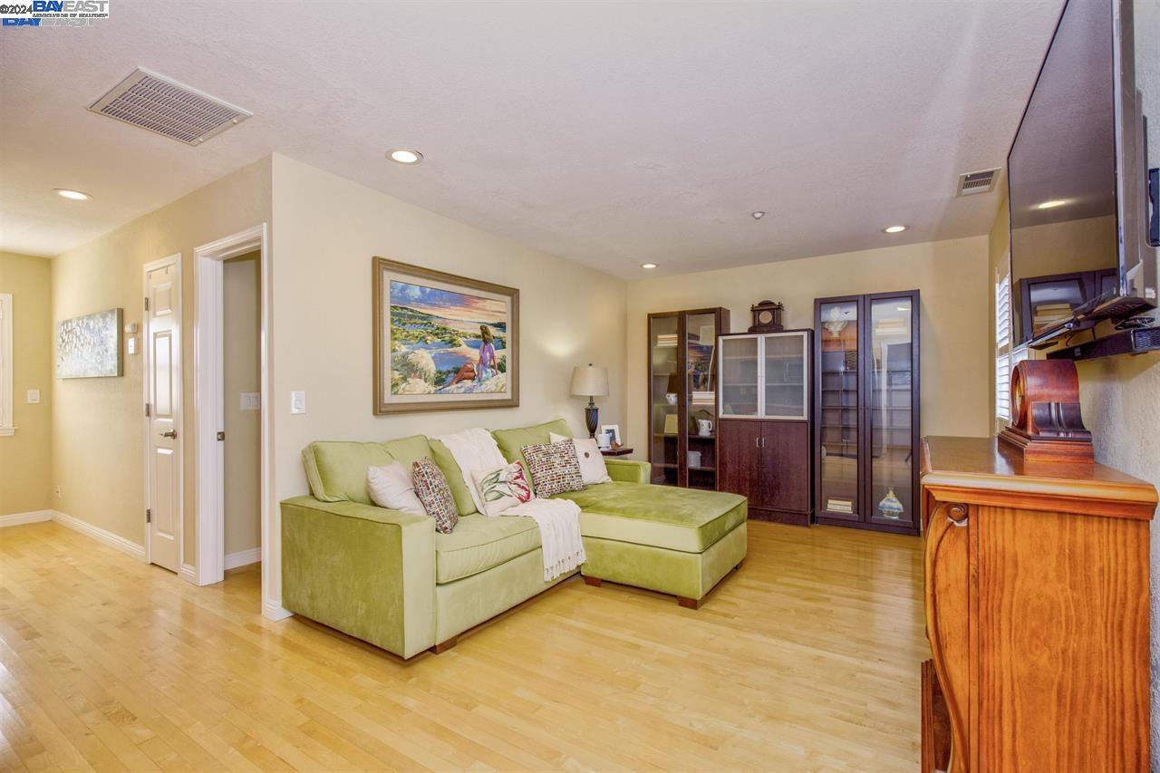 1746 3rd Street, Unit B Livermore, CA 94550 - Photo 3 of 12 a living room with furniture and a flat screen tv