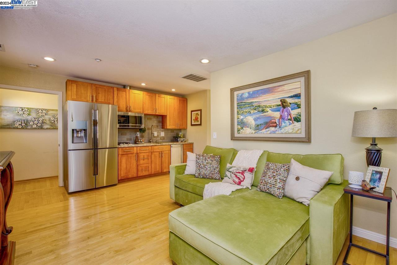 1746 3rd Street, Unit B Livermore, CA 94550 - Photo 4 of 12 a living room with stainless steel appliances furniture and a kitchen view