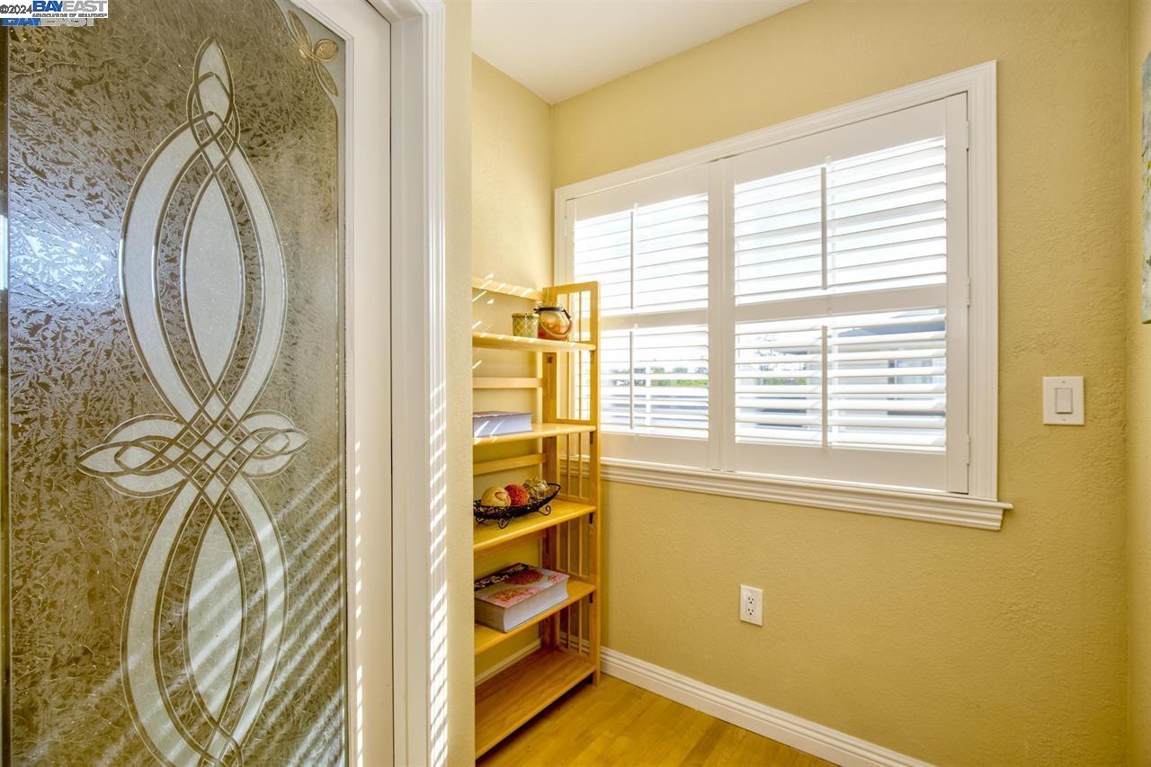 1746 3rd Street, Unit B Livermore, CA 94550 - Photo 10 of 12 a view of a door with a sink and a mirror