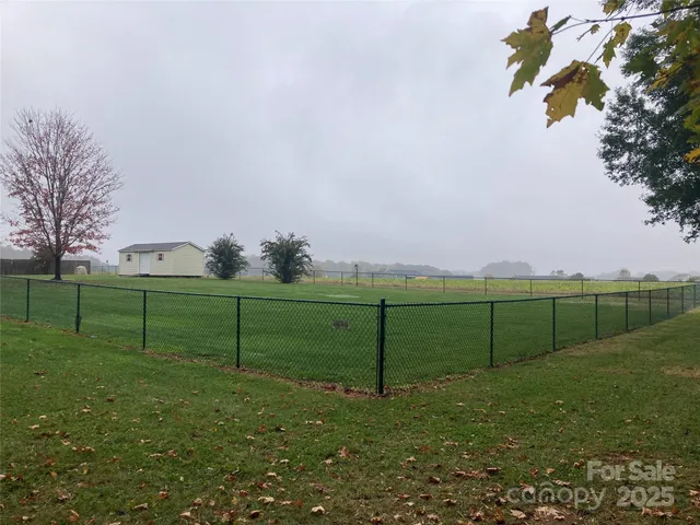 a view of a house with a yard and plants