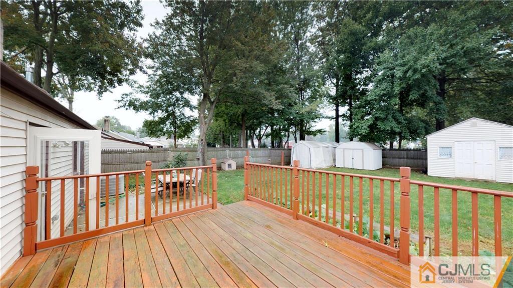 41 Idlewild Road Edison, NJ 08817 - Photo 22 of 23 a view of a balcony with wooden floor and fence