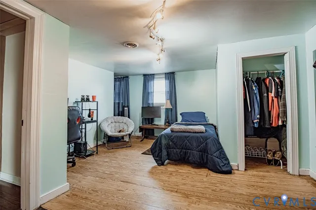 a living room with furniture and a gym machine
