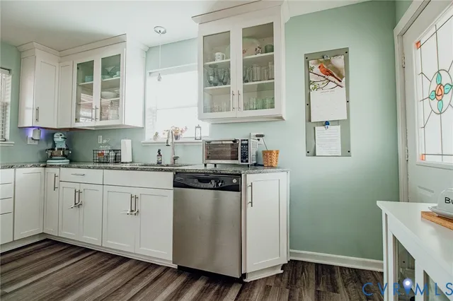 a kitchen with a cabinets and window