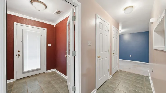 a view of a hallway with closet area