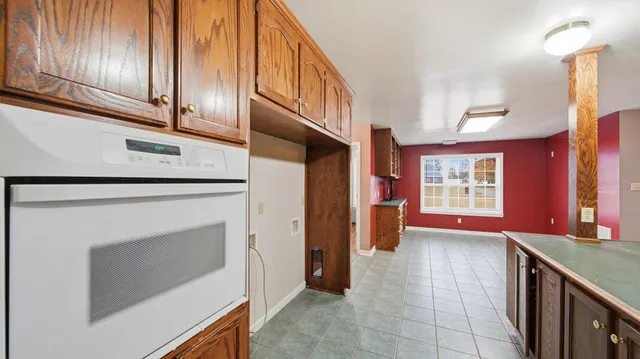 a view of entryway with kitchen