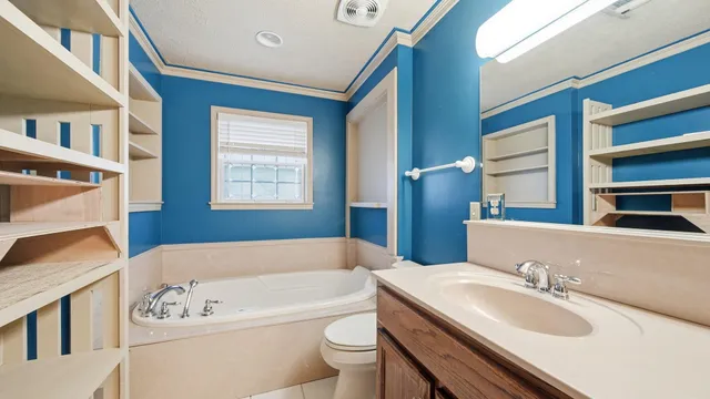 a bathroom with a tub and shower