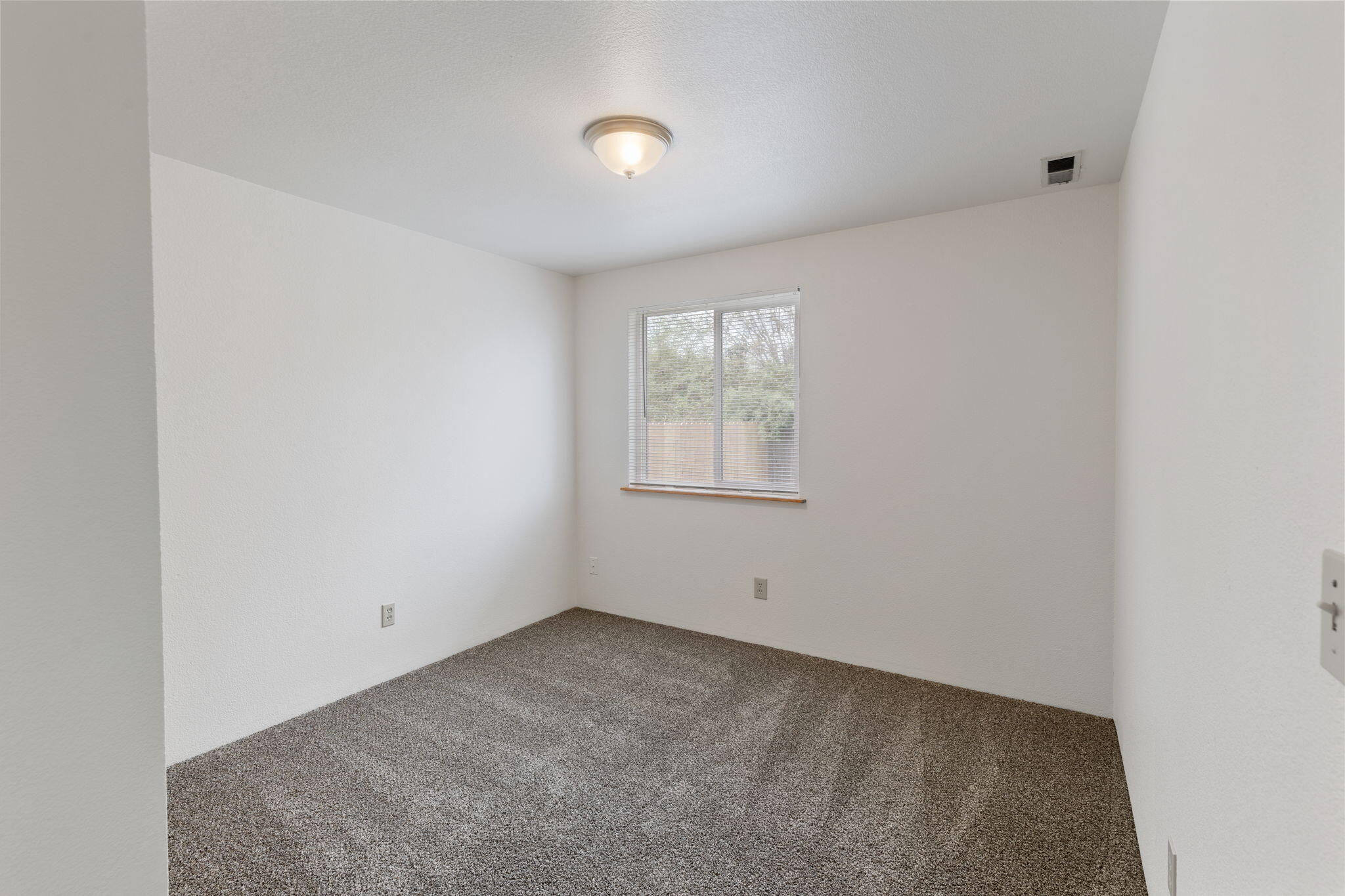 618 Southwest Larch Road Grants Pass, OR 97526 - Photo 15 of 20 second bedroom has large closet and lots of light
