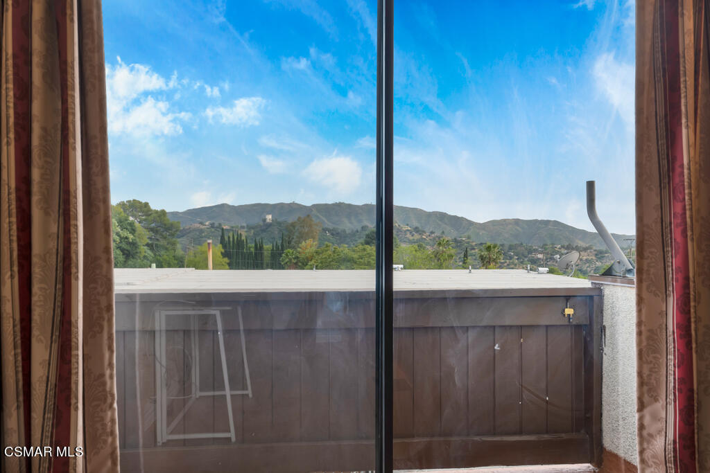 10240 Silverton Avenue, Unit 9 Tujunga, CA 91042 - Photo 17 of 23 a view of a from a window