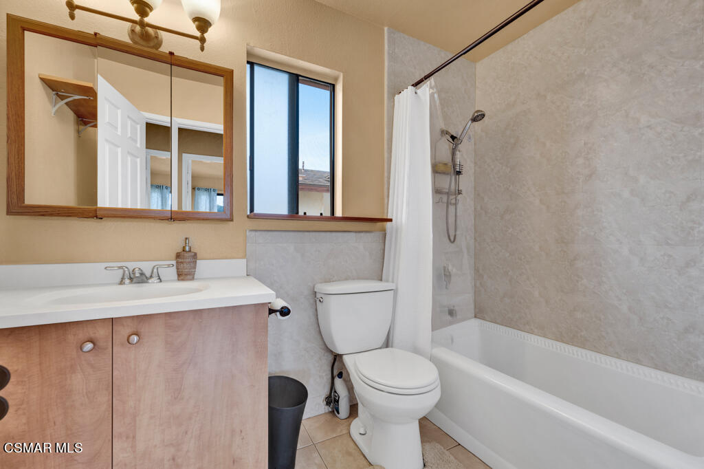 10240 Silverton Avenue, Unit 9 Tujunga, CA 91042 - Photo 19 of 23 a bathroom with a sink a toilet and shower