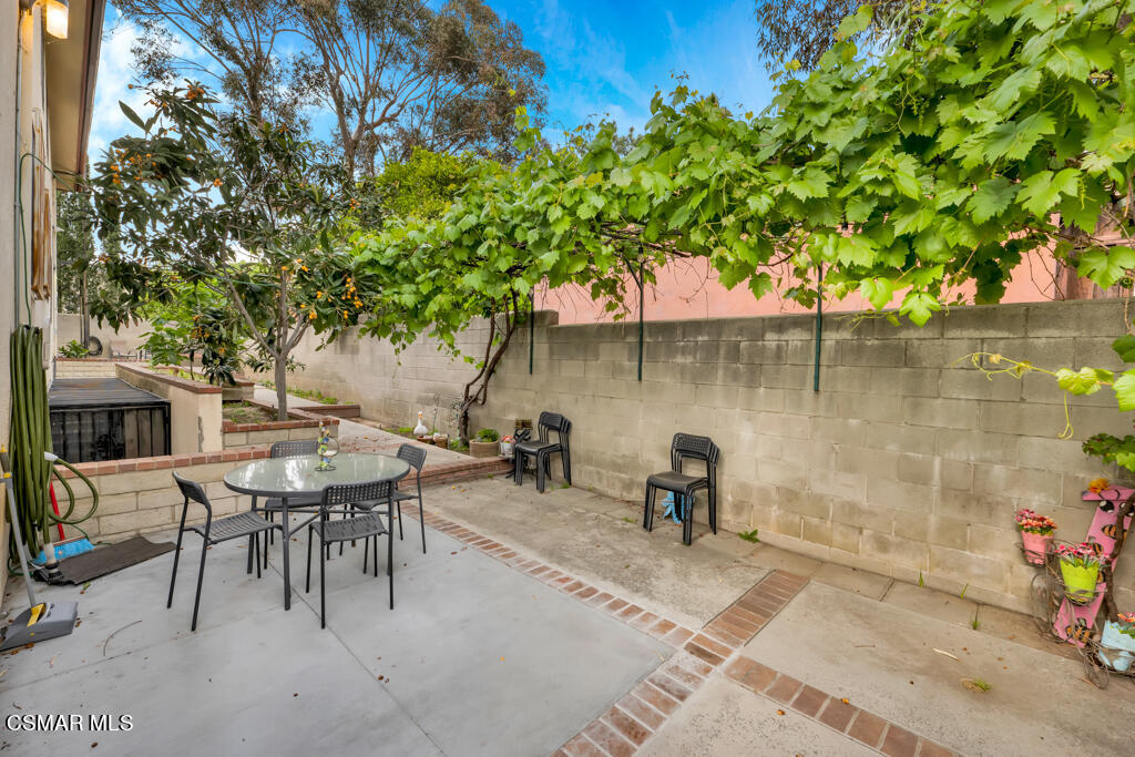 10240 Silverton Avenue, Unit 9 Tujunga, CA 91042 - Photo 22 of 23 an outdoor view with patio