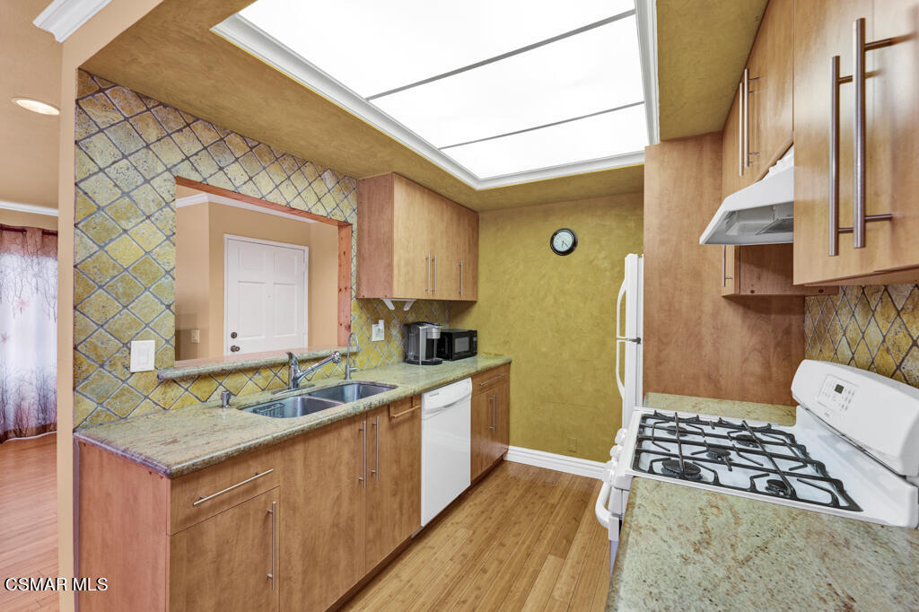 10240 Silverton Avenue, Unit 9 Tujunga, CA 91042 - Photo 4 of 23 a bathroom with a sink and a mirror