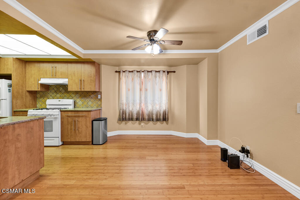 10240 Silverton Avenue, Unit 9 Tujunga, CA 91042 - Photo 8 of 23 a view of kitchen with granite countertop cabinets and window