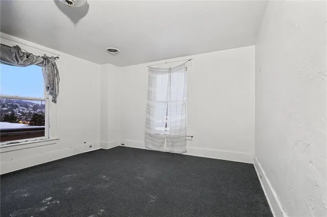 a view of room and hardwood floor