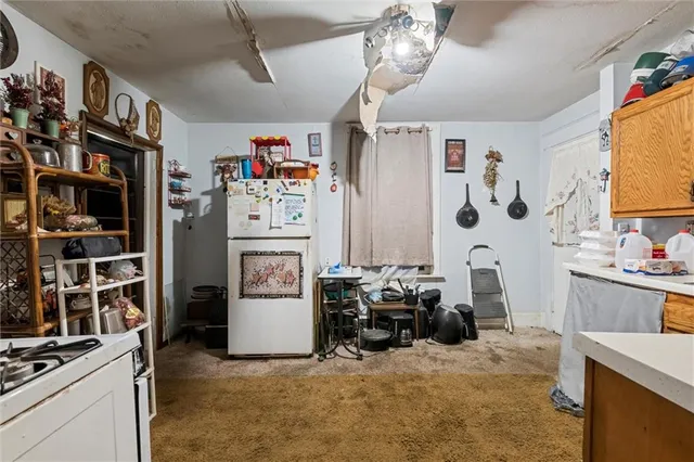 a room with furniture and a kitchen