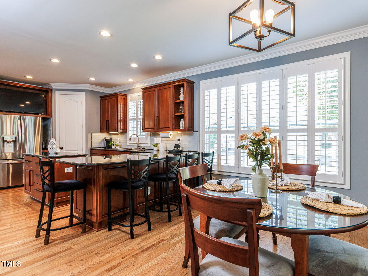 1808 Pattersons Mill Road Durham, NC 27703 - Photo 9 of 42 A gathering place, lovely hardwood flooring, custom Kitchen, plantation shutters, designer lighting, recessed lighting.