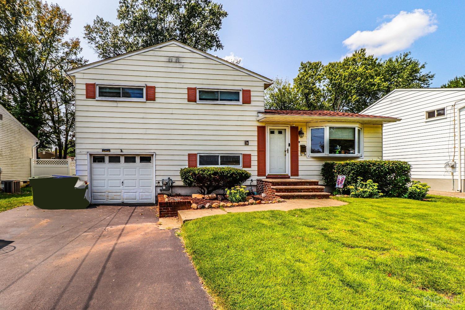 24 Finley Road Edison, NJ 08817 - Photo 1 of 27 a view of a house with a patio