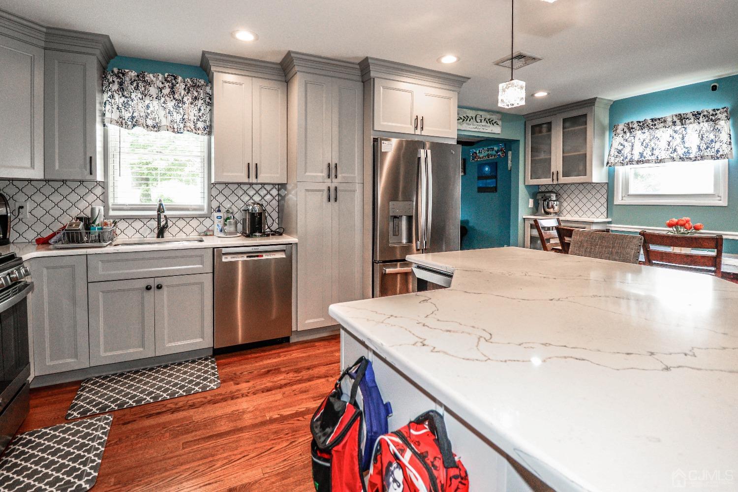 24 Finley Road Edison, NJ 08817 - Photo 13 of 27 a kitchen with stainless steel appliances granite countertop a sink a stove and refrigerator