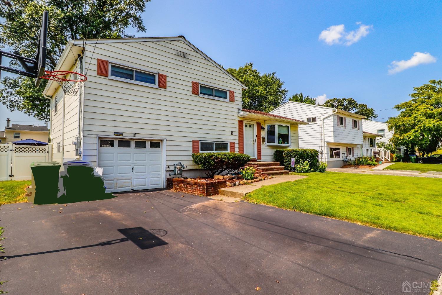 24 Finley Road Edison, NJ 08817 - Photo 2 of 27 a view of a house with a patio