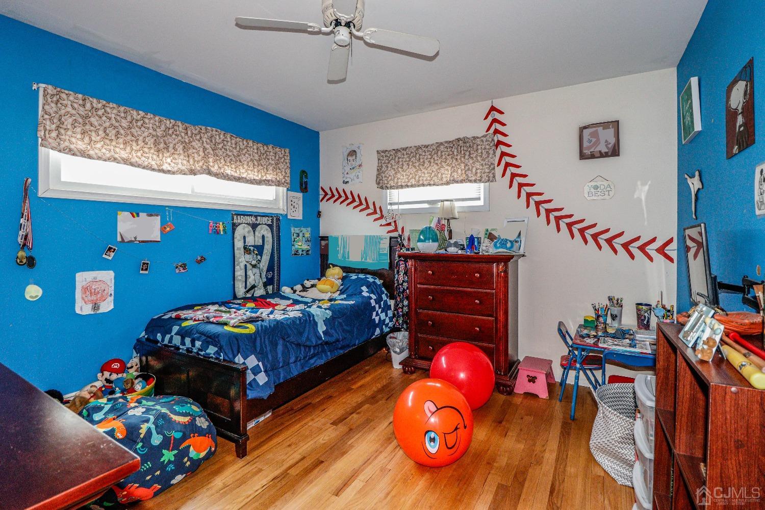 24 Finley Road Edison, NJ 08817 - Photo 21 of 27 a bedroom with a bed closet and flat tv screen