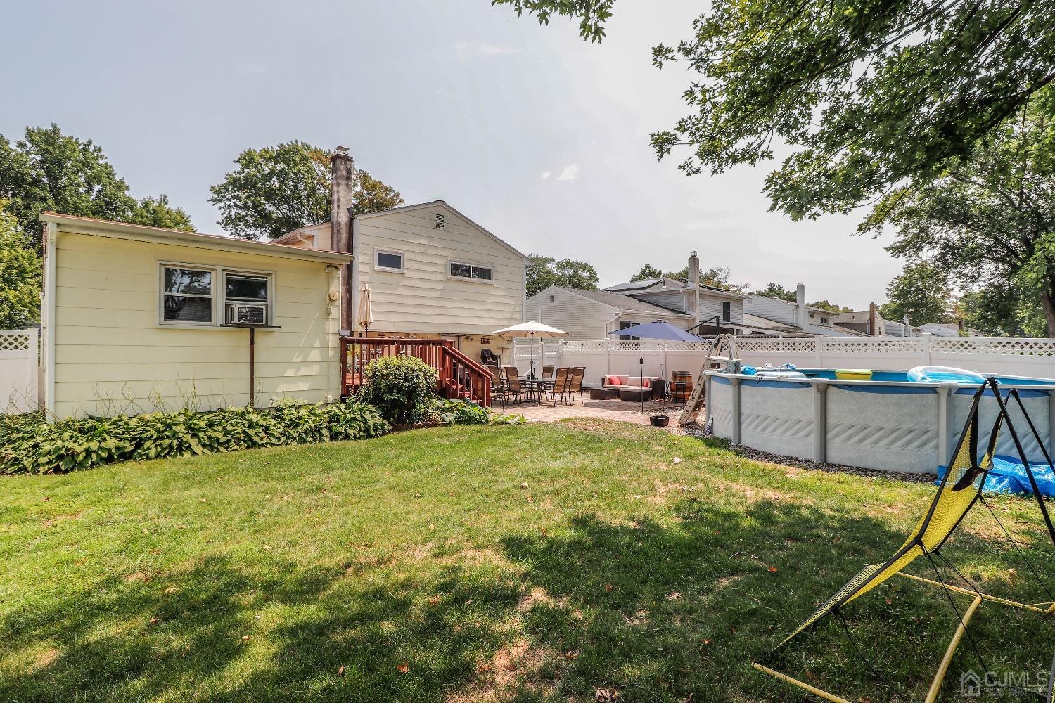 24 Finley Road Edison, NJ 08817 - Photo 25 of 27 a swimming pool view with a outdoor seating