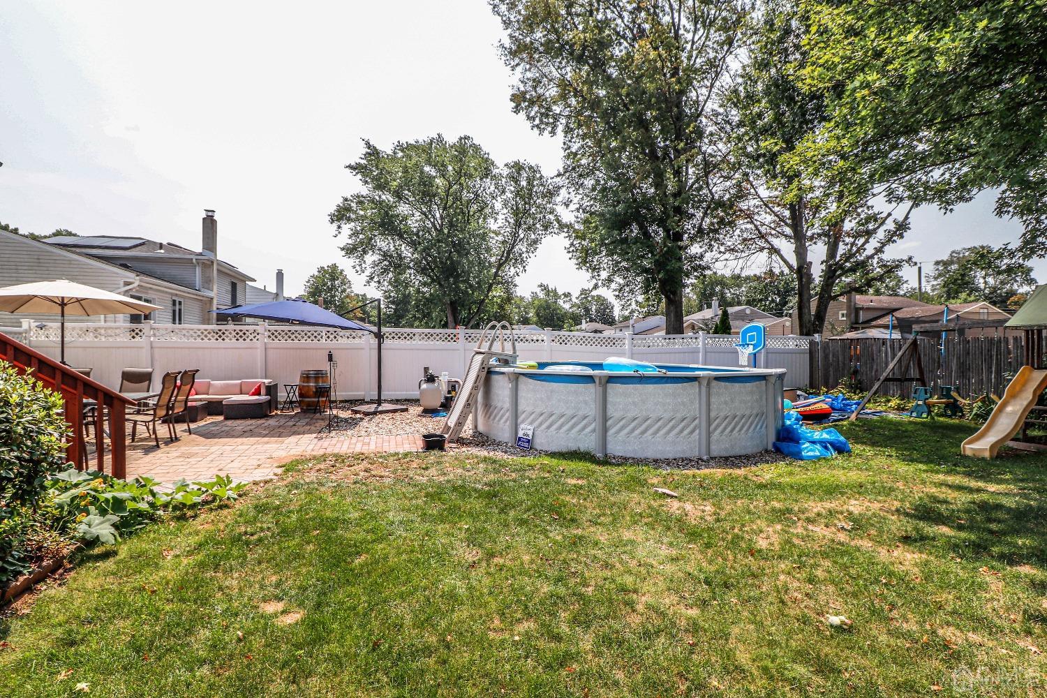 24 Finley Road Edison, NJ 08817 - Photo 26 of 27 a view of a house with backyard and sitting area