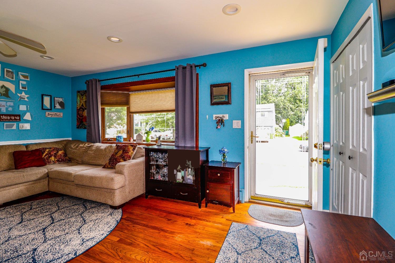 24 Finley Road Edison, NJ 08817 - Photo 5 of 27 a living room with furniture and a window