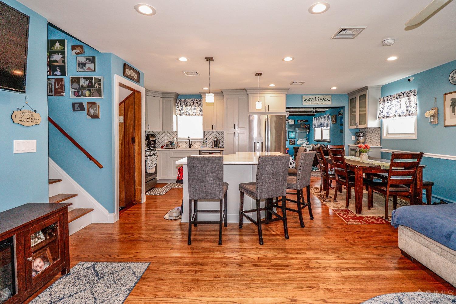 24 Finley Road Edison, NJ 08817 - Photo 10 of 27 a view of dining room kitchen with stainless steel appliances granite countertop a stove top oven a dining table and chairs
