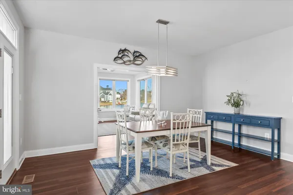 a view of a livingroom with furniture cabinet and window