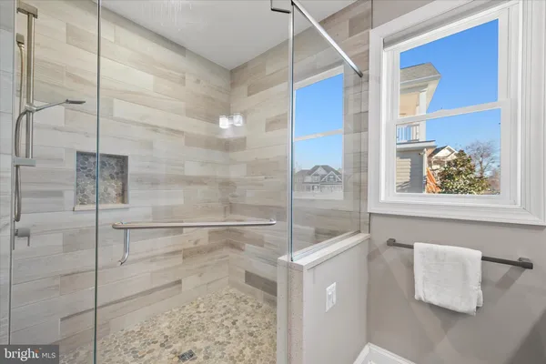 a bedroom with a bed and ceiling fan