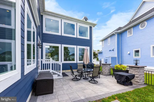 an aerial view of a house with a yard and lake view