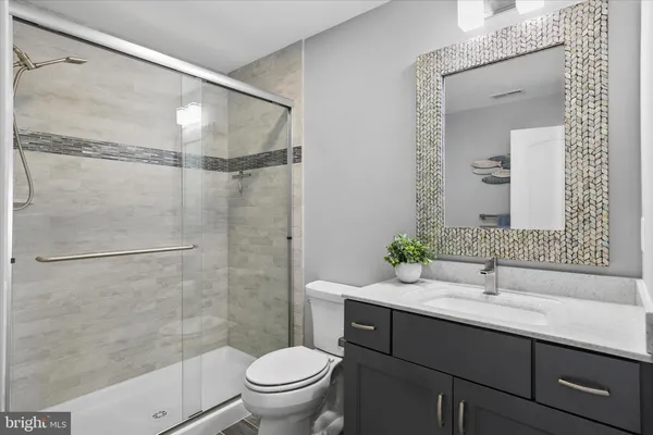 a view of a trees with yard in front of it